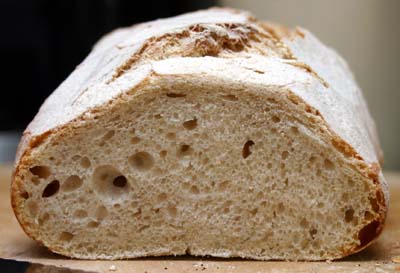 One of the floured loaves freshly cut